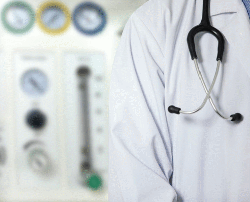 Doctor with stethoscope in medical setting.