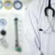 Doctor with stethoscope in medical setting.